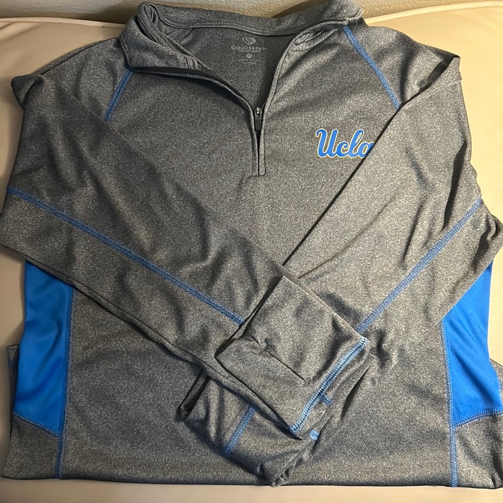 A women’s UCLA Bruins colosseum fitted quarter zip sleeve top